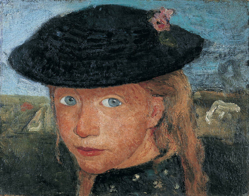 Kopf eines kleinen Mädchens mit Strohhut