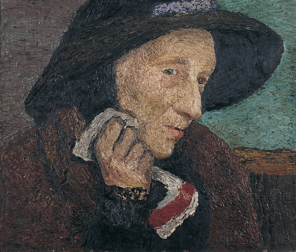 Alte Frau mit schwarzem Strohhut
