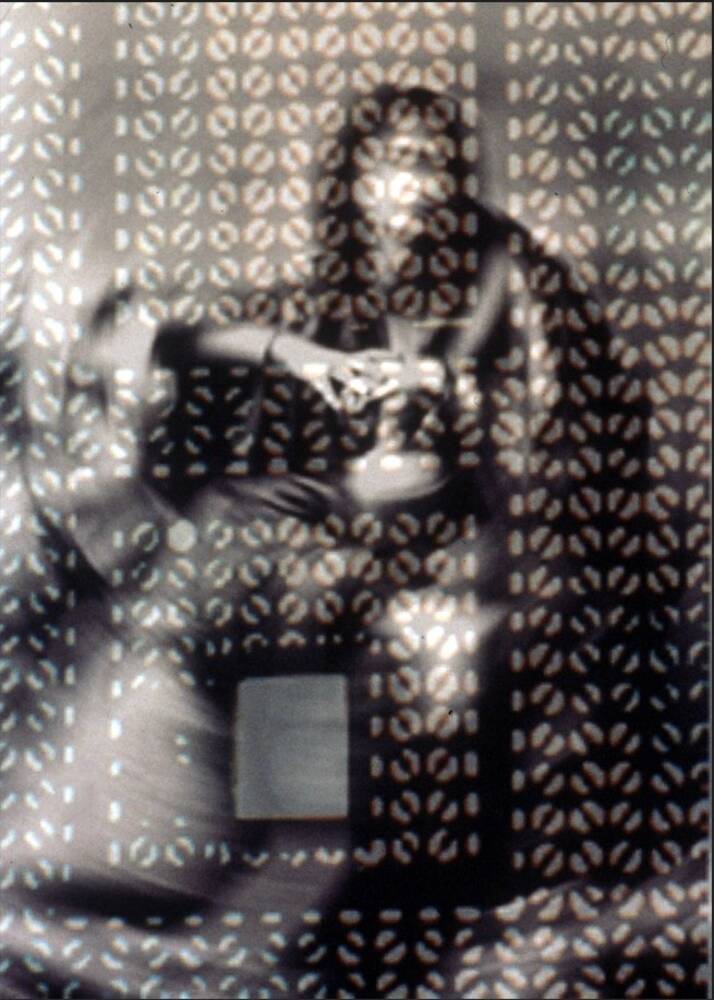 Woman behind Mashrabiya